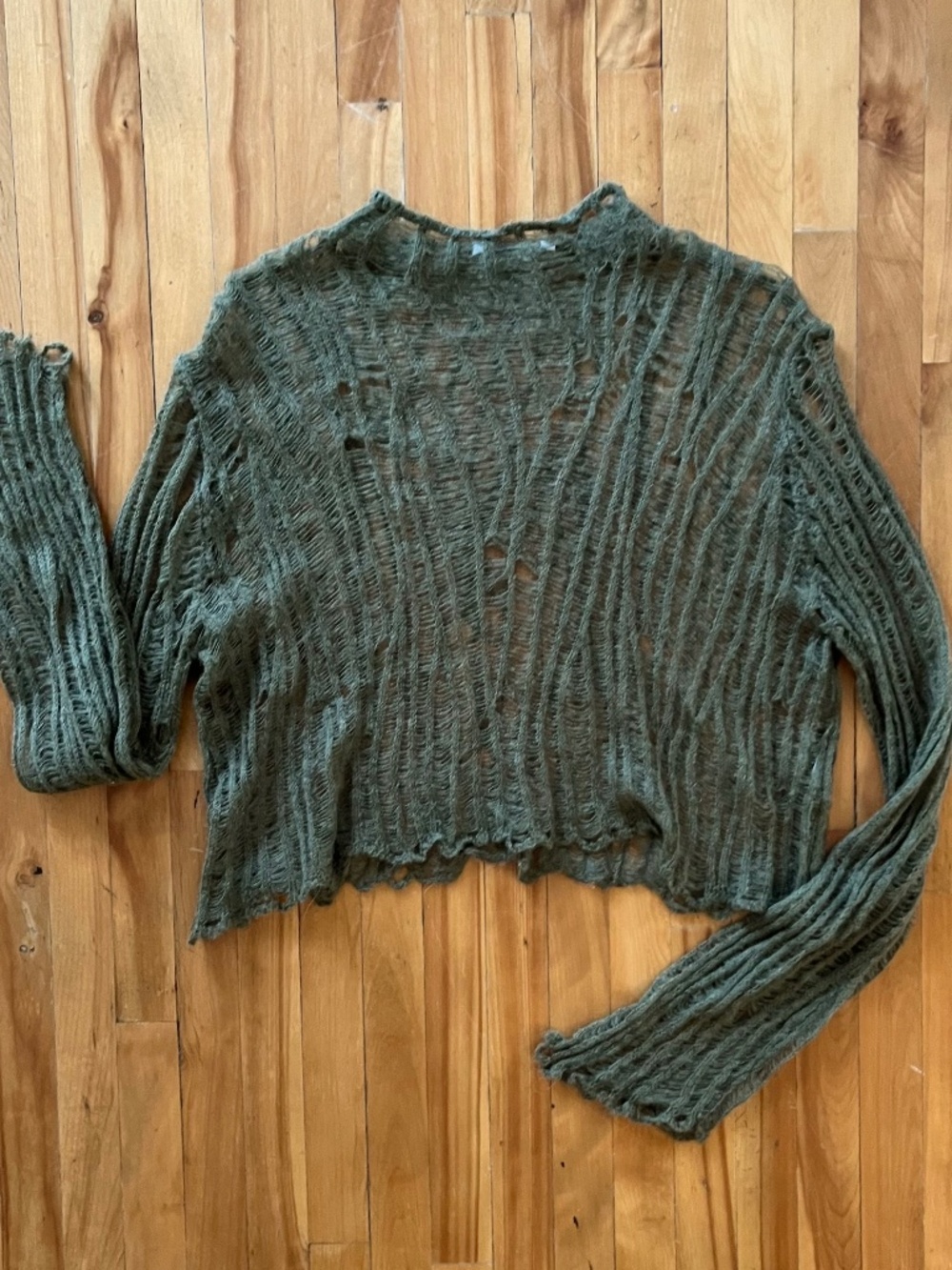 Grunge open knit crop sweater with ruffled hem in green